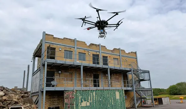 Safe Inspection of Tall Buildings with Autonomous Aerial Mapping