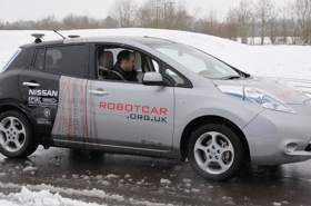 Robotcar driving on ice covered road.