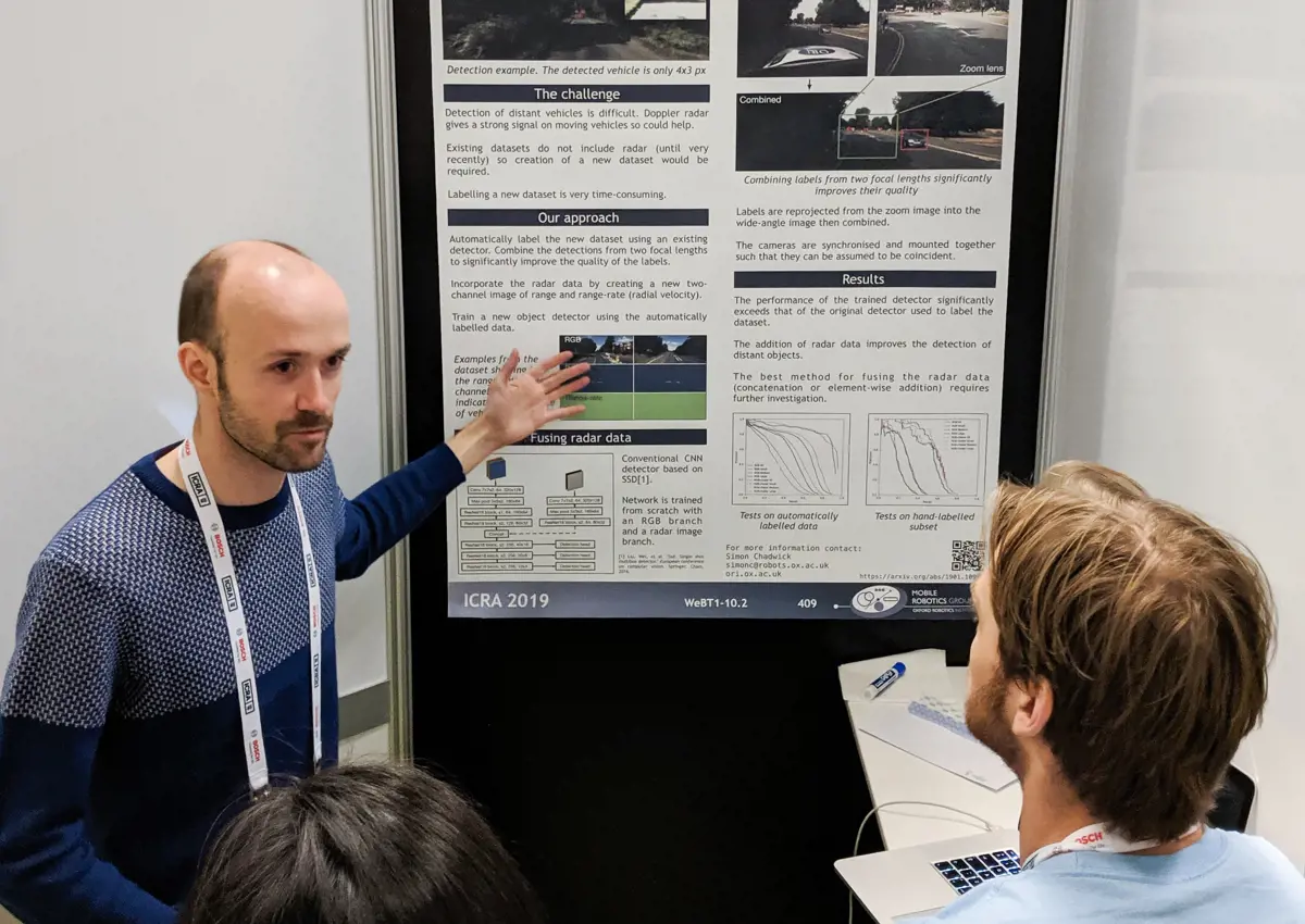 Researcher presenting a poster