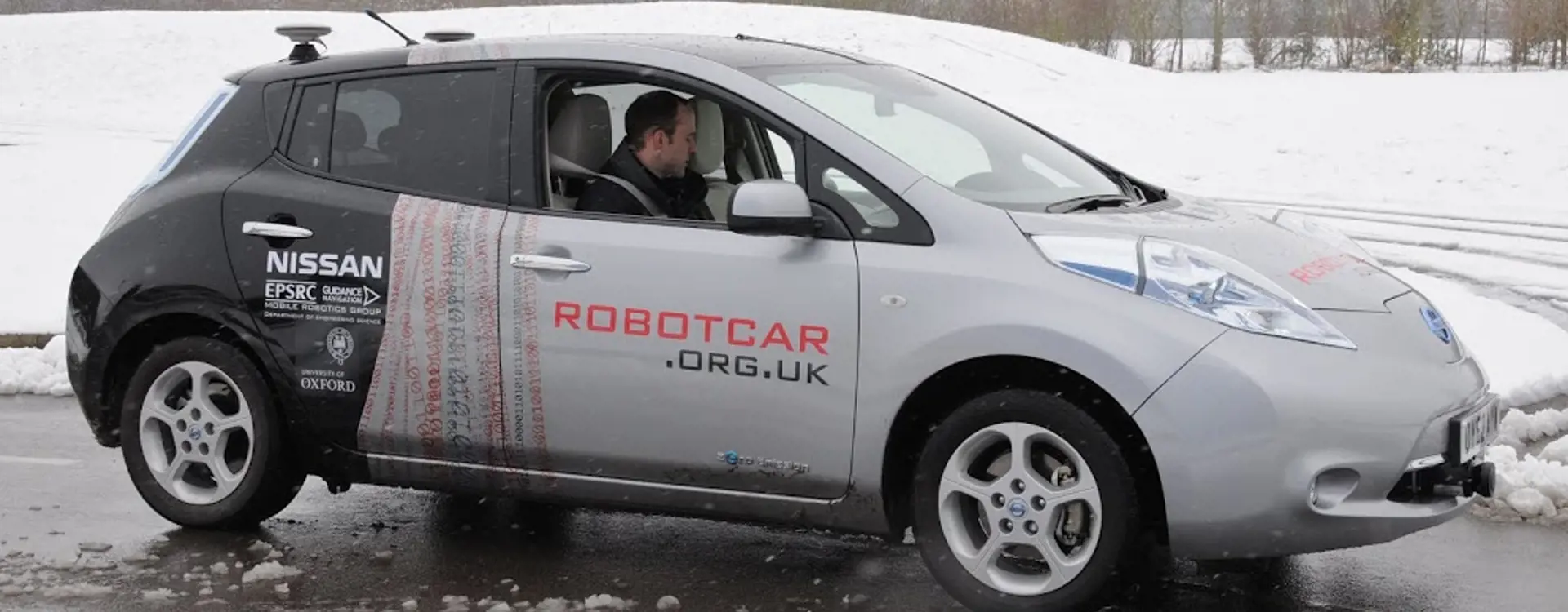 A robot car driving in the rain