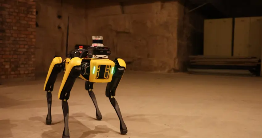 SafeEstMDP, integrated on a Spot robot platform, explores a hazardous subterranean area